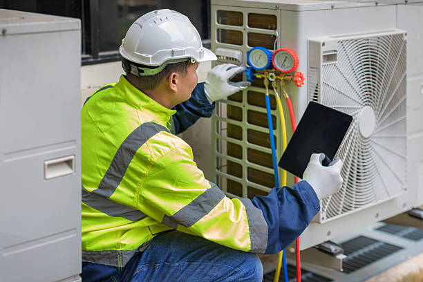 Professional Air Duct Cleaning technician working in Russell, KS